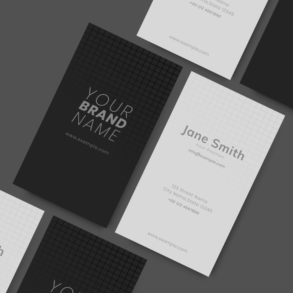 Black and white business card mockups with brand name and contact details on a dark surface